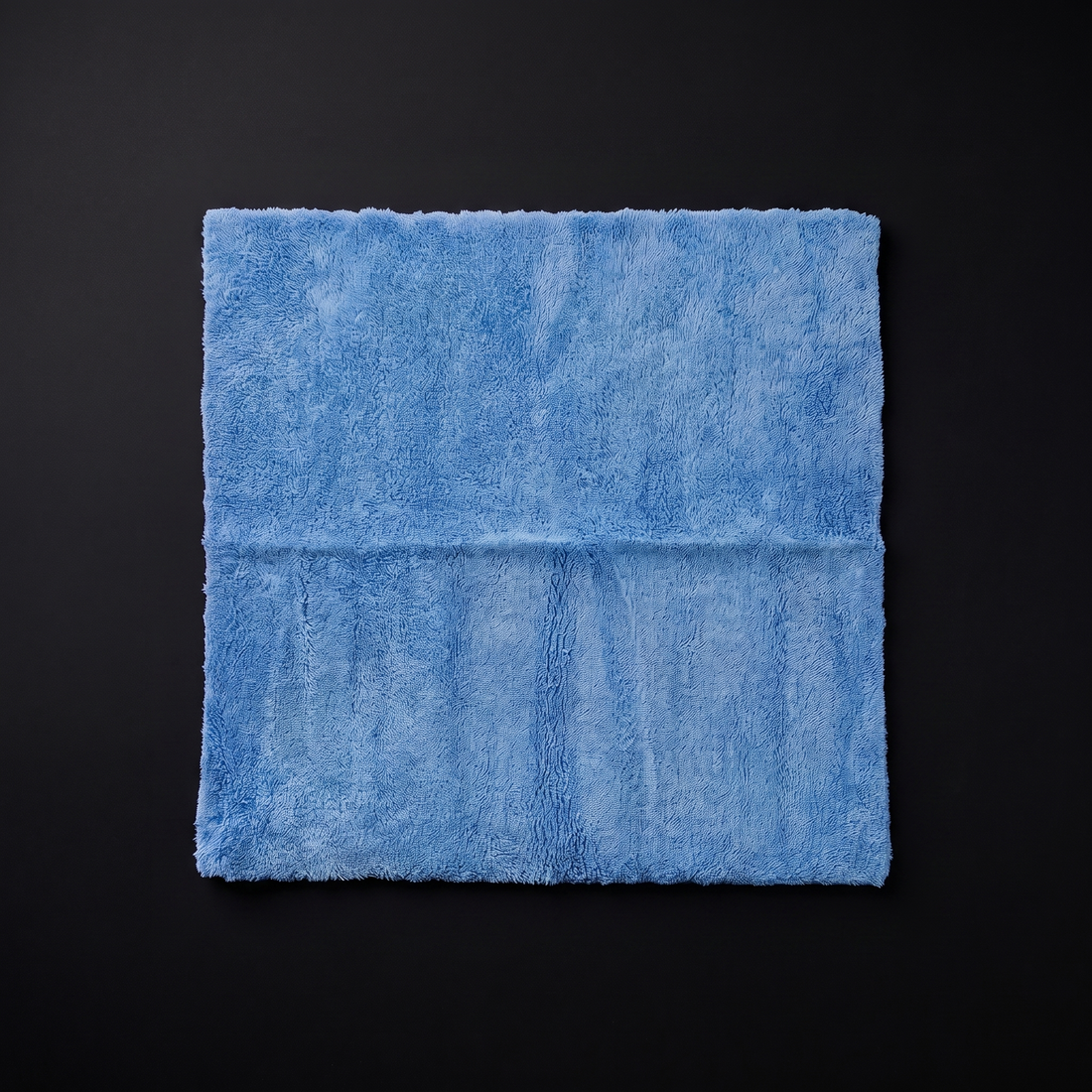 blue squares towel flat lay