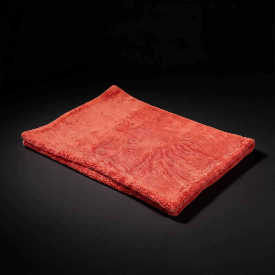 orange drying towel flat lay